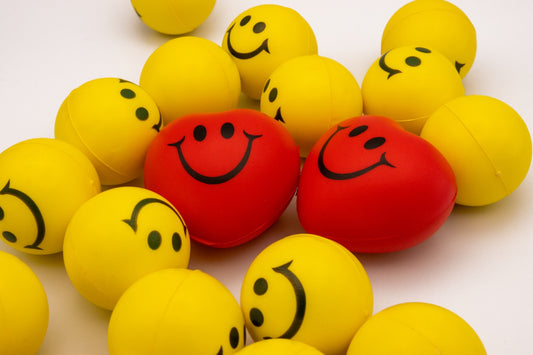 a bunch of balls with faces drawn on them