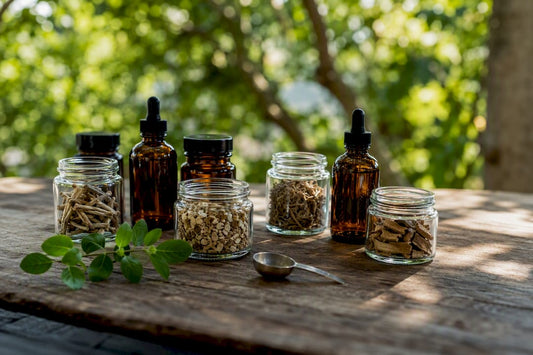 Jars of adaptogen herbs and powders on wood table