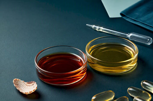 Anonymous omega-3 oils and capsules in glass dishes