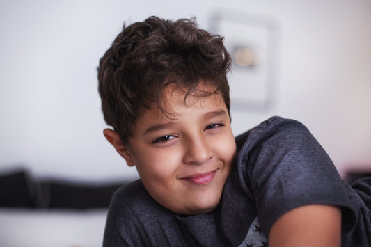boy laying on bed