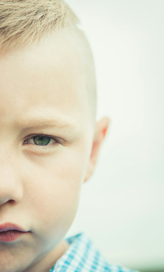 boy in blue and white collared shirt
