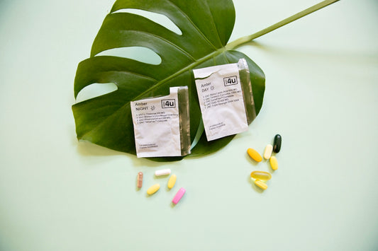white and yellow medication pill on green leaf