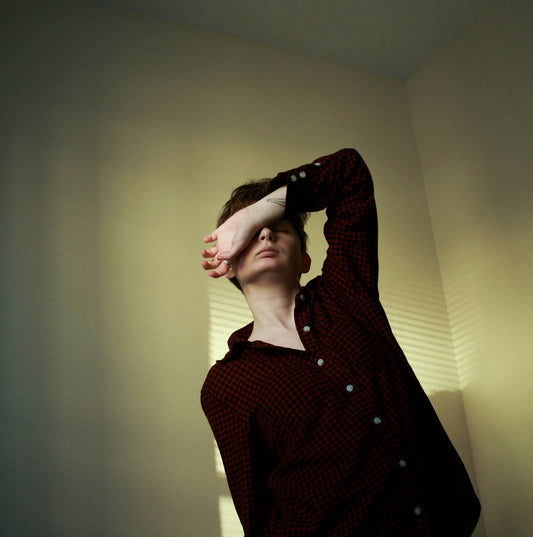 woman in red and black checked button up long sleeve shirt