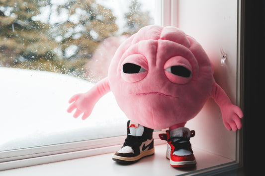 red plush toy on white wooden table