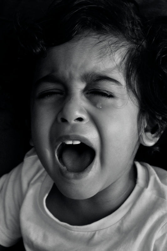 grayscale photo of boy in crew neck shirt
