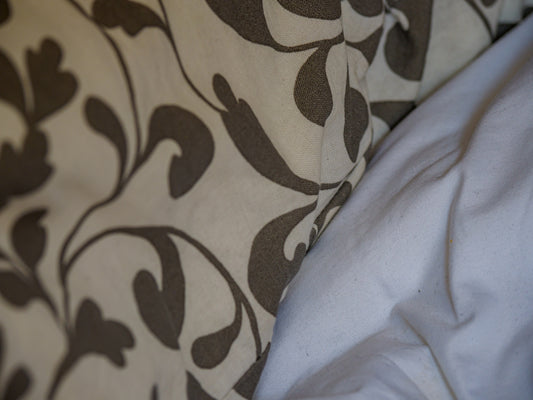 white and black floral textile