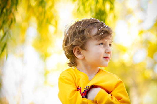 girl in yellow hoodie standing during daytime