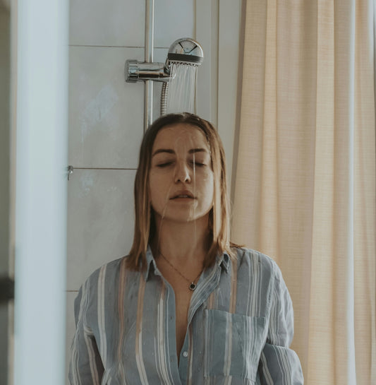 woman in blue and white stripe button up shirt