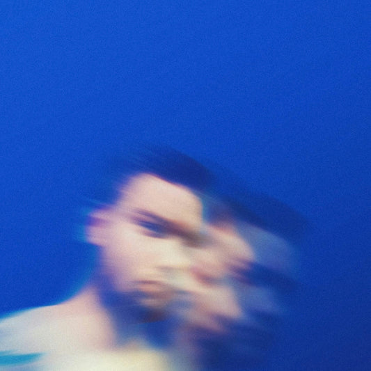 man in black shirt under blue sky