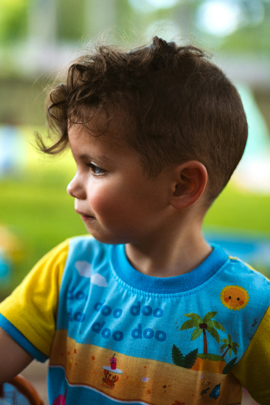 boy in blue and yellow crew neck shirt