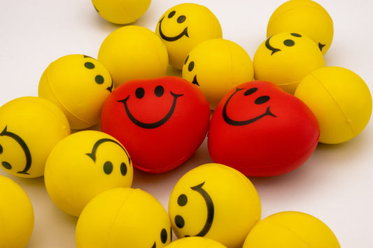 a bunch of balls with faces drawn on them