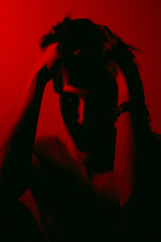 a woman with her hands on her head