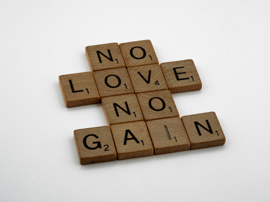 scrabble tiles spelling no love no gain