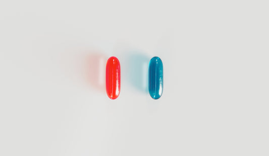 a pair of red and blue surfboards sitting next to each other