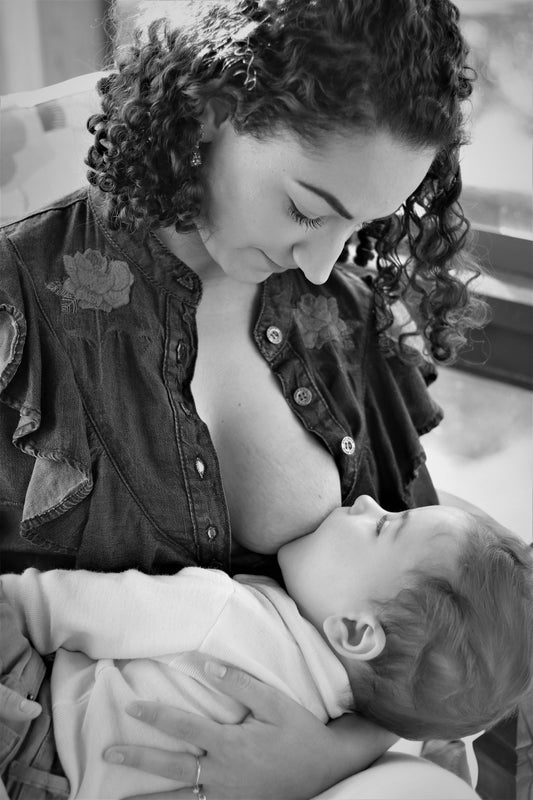 a woman holding a baby in her arms