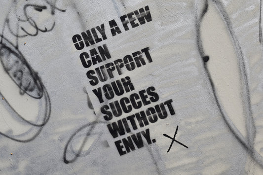 graffiti on the side of a wall that says only a few can support your success