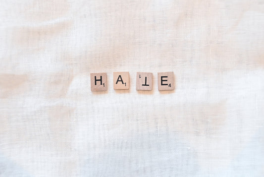 the word hale spelled with scrabble letters on a linen background