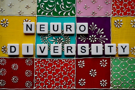 the word neuro university spelled with scrabble tiles