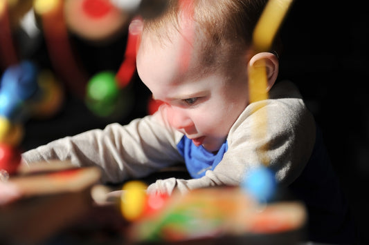 a young child playing with toys in a room