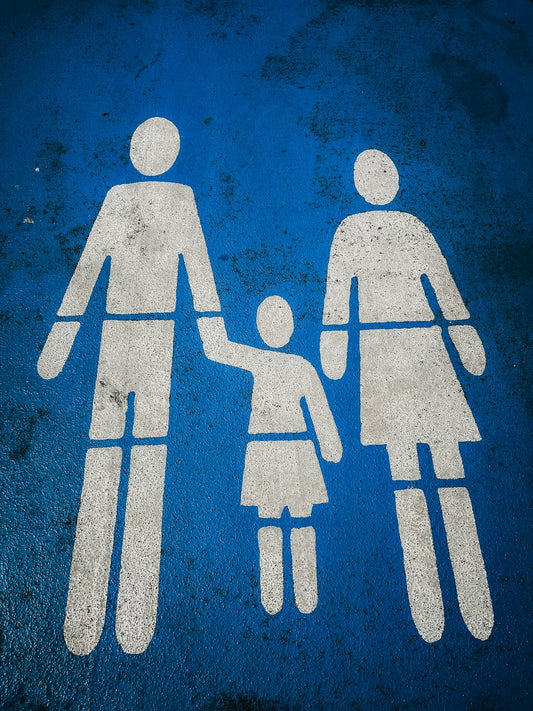 a blue and white sign with a picture of a man and a woman holding hands
