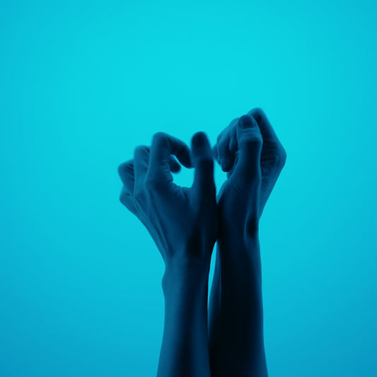 a person with their hands up in the air