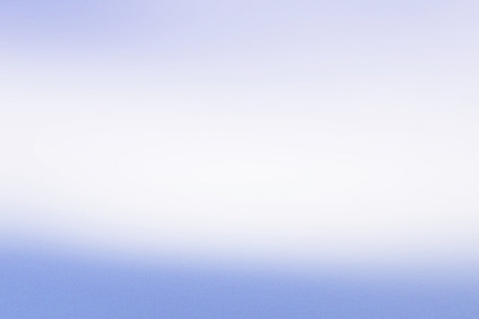 a person flying a kite in a blue sky