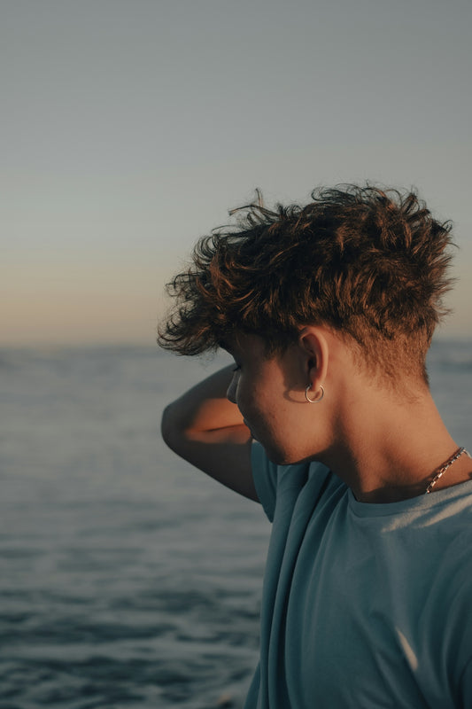 a woman with her hair blowing in the wind