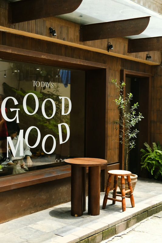 A store front with a sign that says good mood