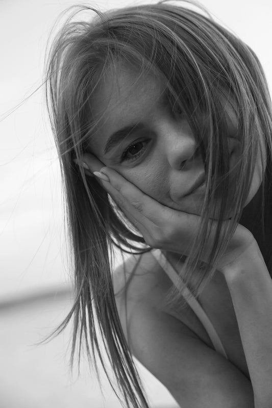 A woman with her hands on her face