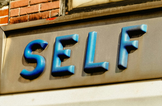 A close up of a sign on the side of a building