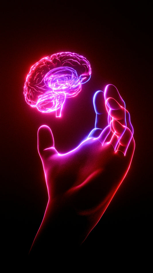 A person's hand holding a glowing brain model