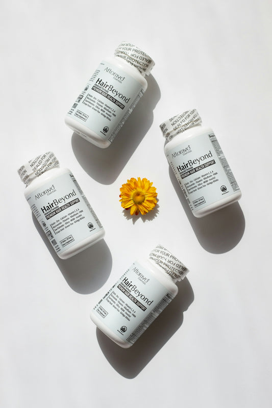 Four bottles of medicine with a yellow flower on top