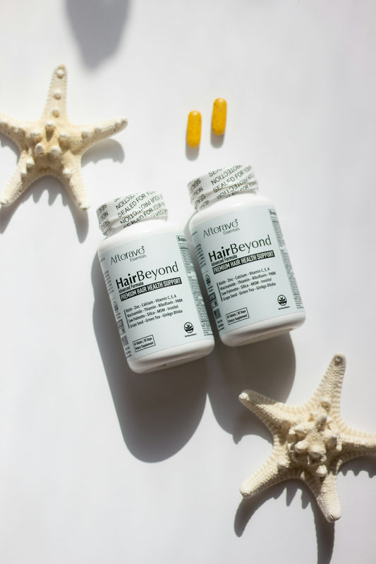 A couple of bottles of pills sitting next to a starfish