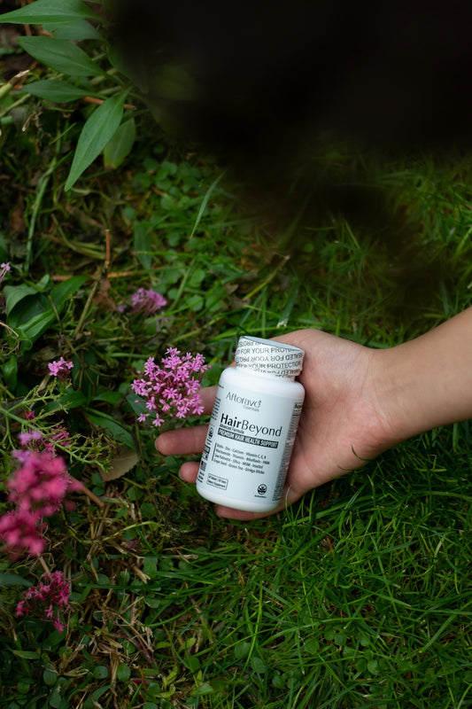 A person holding a bottle of medicine in their hand