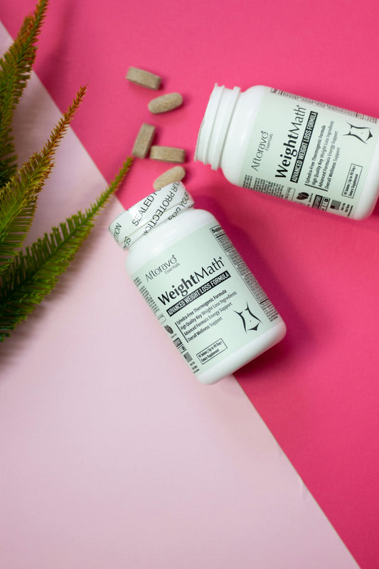 A bottle of vitamin pills next to a plant on a pink and white background