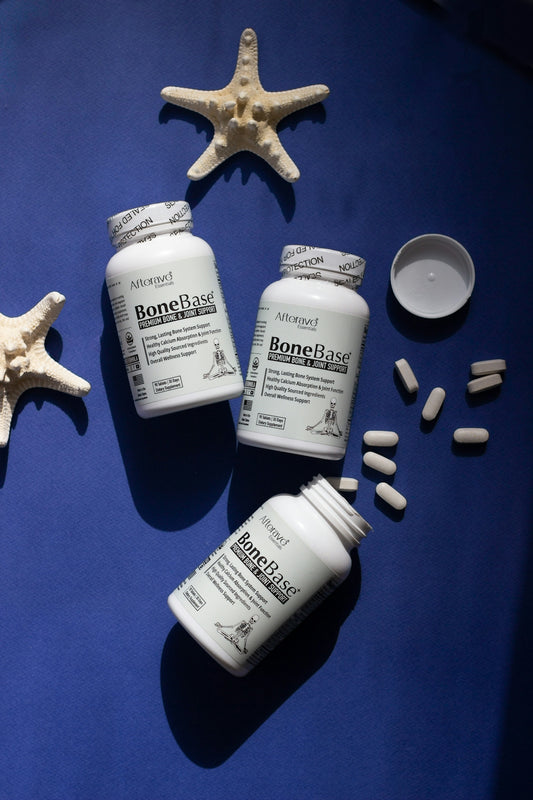 A blue table topped with bottles of pills and starfish
