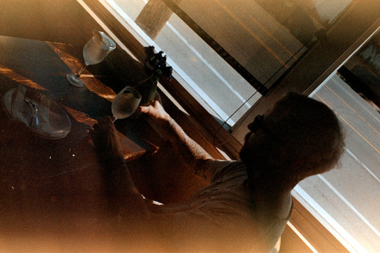 A woman standing in front of a mirror in a room