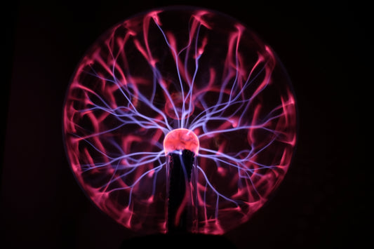 A close up of a spinning object in the dark