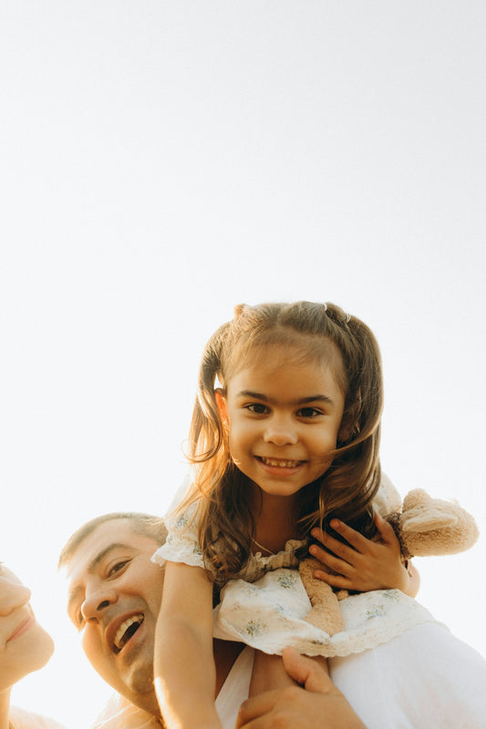A woman holding a little girl in her arms
