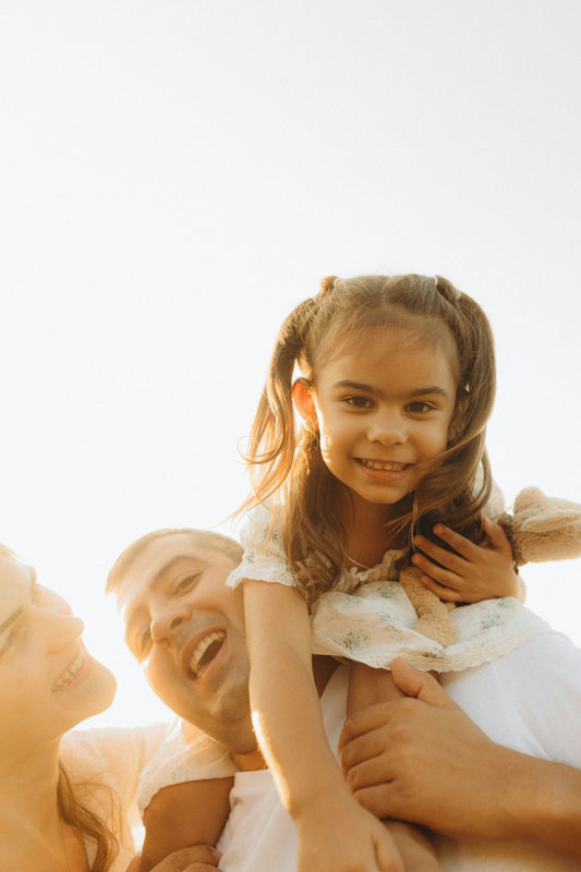 A woman holding a little girl in her arms