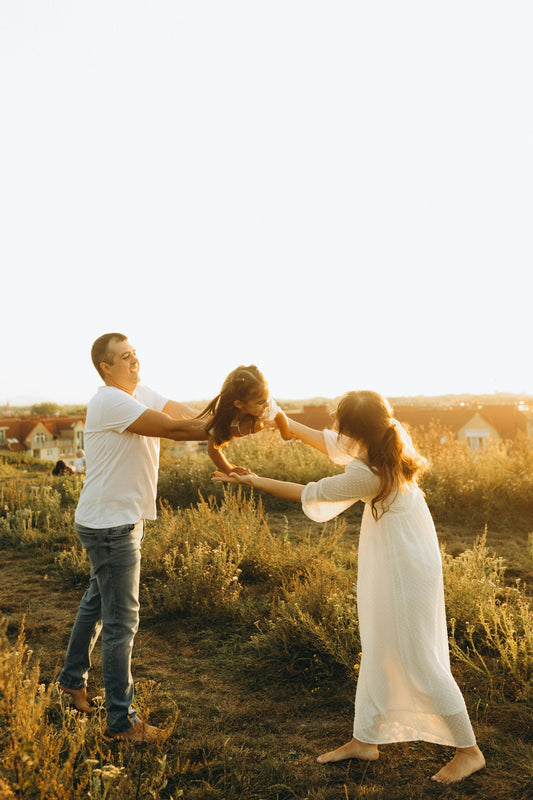 A man and a woman standing in a field