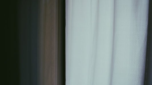 Soft, white curtains in natural light.