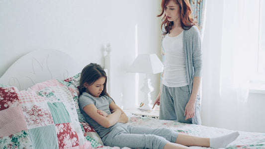 A mother confronts her child, who is upset.