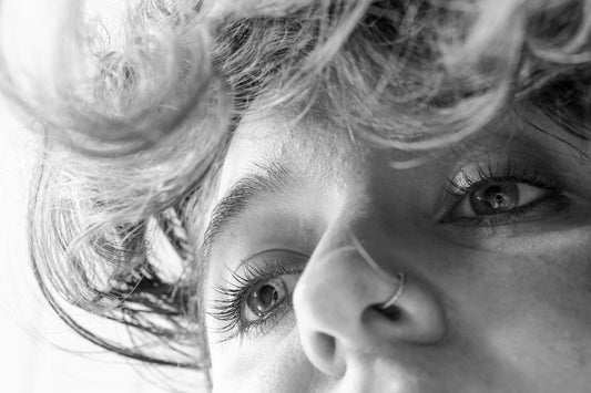 Close-up of a woman's eyes and curly hair