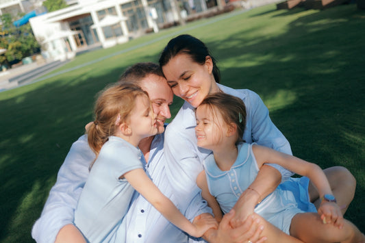 A happy family with two daughters enjoying outdoors