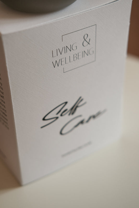 A white box with living & wellbeing and self care